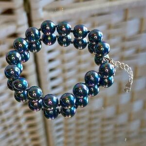 Peacock Color Shell Pearl 9-11mm
Bracelet in Rhodium On Sterling Silvr 7.5-8.51”